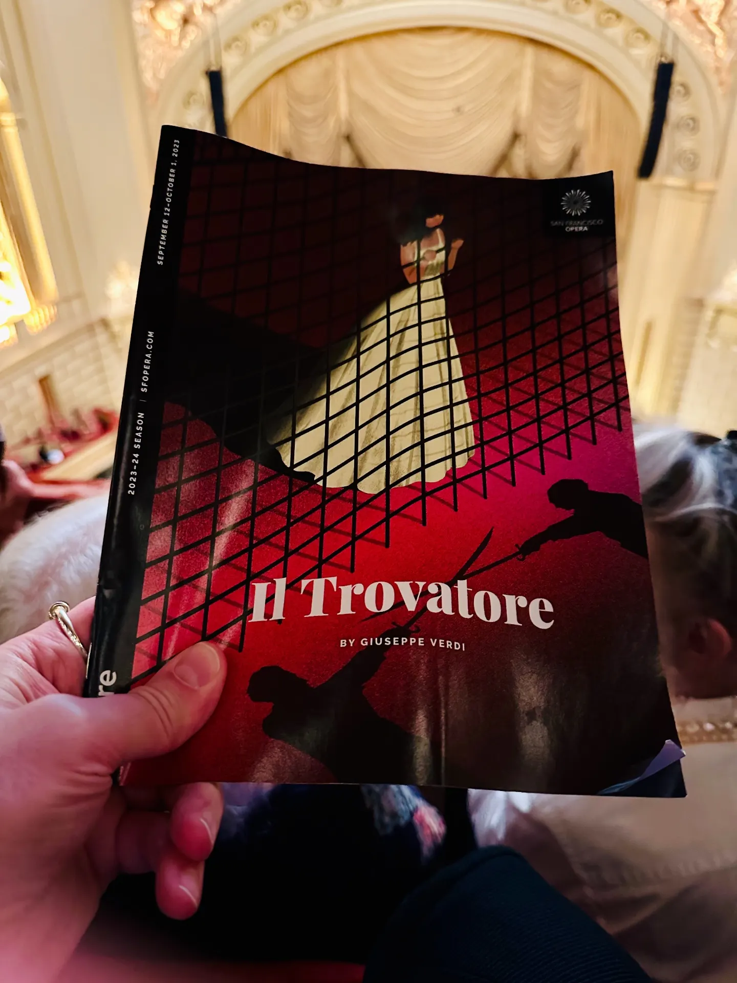 Il Trovatore program held in the War Memorial house, gilded proscenium and curtain behind